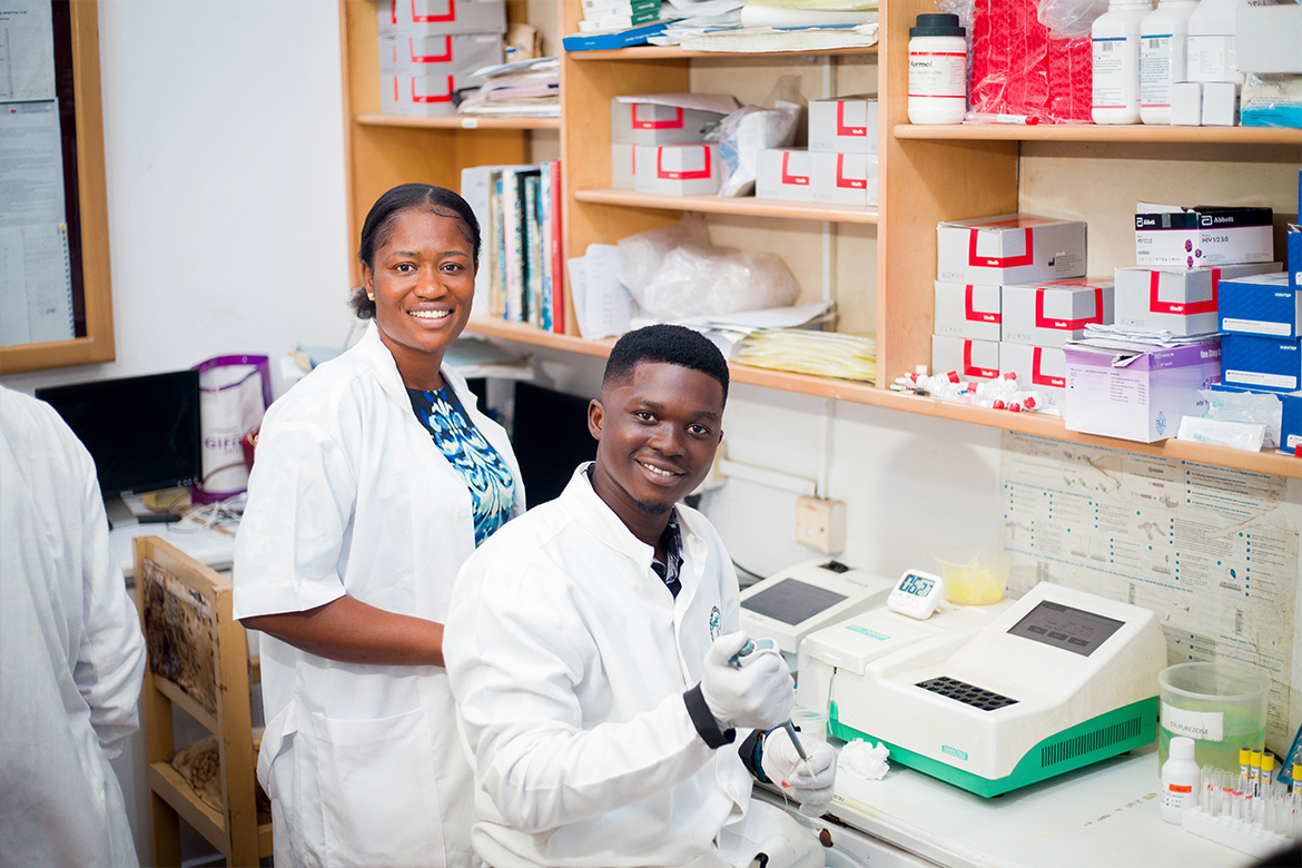 Doctor providing caring medical attention to young patients at Atasemanso Hospital